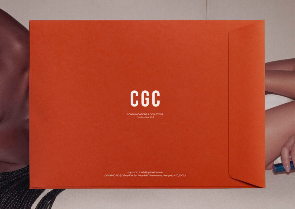 The image depicts a red envelope with Clare Goodwin Communications and Collective's logo and contacts printed in white.