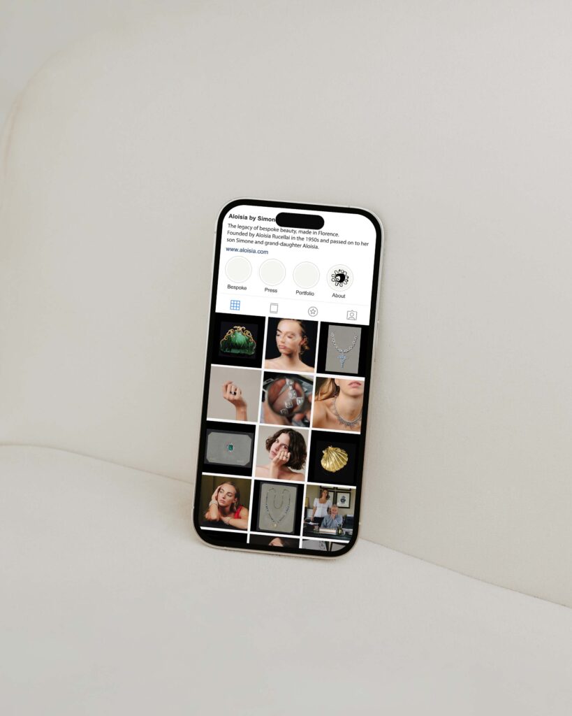 A photo of a mobile phone showing Aloisia’s Instagram feed. Aloisia is a jewelry brand whose visual identity and art direction was curated by Osmo.